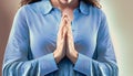 praying woman in blue shirt suitable as background