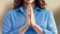 praying woman in blue shirt suitable as background