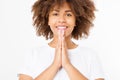 Praying young afro american girl. African woman in summer shirt isolated on white background. Copy space. Mock up. Make a wish Royalty Free Stock Photo