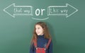 Pre-adolescent girl thinks about which way to choose, left or right