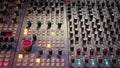 Pre amp knobs and switchers on mixing console panel board