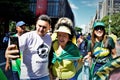 Pre-candidate doctor Nise Yamaguchi takes a selfie with voters on Paulista avenue