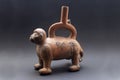 Pre-columbian animal-shaped ceramic called `Huaco` from unidentified ancient Peruvian culture.