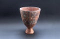Pre-columbian ceramic vase called `Huaco` from Nazca, an ancient Peruvian culture.