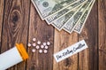 Pre-Existing Condition healthcare concept is expensive concept with pills and money, flat lay Royalty Free Stock Photo