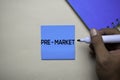 Pre - Market text on sticky notes with office desk. Stock Market Exchange Concept