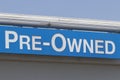 Pre-Owned Cars sign at a used car dealership. As supplies of new cars dwindle, used cars become more popular Royalty Free Stock Photo