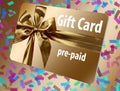 A pre-paid gift card is seen here. It is gold with a gold ribbon design on the front