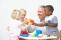 Pre School Children Enjoying Tea Party With Teacher Royalty Free Stock Photo