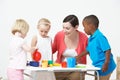 Pre School Children Enjoying Tea Party With Teacher Royalty Free Stock Photo