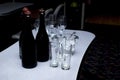 Pre-serving, consisting of a bottle of champagne, glasses and an ice bucket. Background Royalty Free Stock Photo