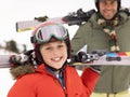 Pre-teen Boy With Father On Ski Vacation Royalty Free Stock Photo