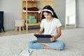 Pre-teen girl using tablet studying online Royalty Free Stock Photo