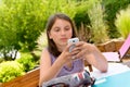 Pre teenager girl texting on mobile phone Royalty Free Stock Photo