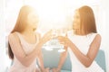 Pre-wedding care. Girls at a hen-party. They sit on the couch with a glass of champagne.