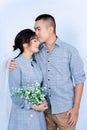 Pre-wedding Portrait Of A Young Asian Couple Dressed In The Same Blue Tones, Happily Posing For Each Other`s Expressions Of Love
