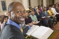 Preacher at altar with Bible preaching to Congregation portrait close up Royalty Free Stock Photo