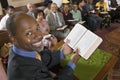 Preacher at altar holding open Bible in Front of Congregation portrait high angle view Royalty Free Stock Photo