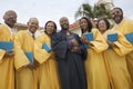 Preacher and Choir in church garden portrait low angle view Royalty Free Stock Photo