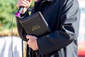 Preacher, pastor with the Bible in his hands during the sermon, the proclamation of the speech Royalty Free Stock Photo