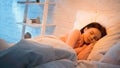 Preadolescent kid sleeping on white bedding Royalty Free Stock Photo