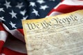 Preamble to the Constitution of the United States and American Flag close up