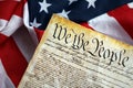 Preamble to the Constitution of the United States and American Flag close up