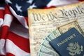 Preamble to the Constitution of the United States, money and passport on American Flag Royalty Free Stock Photo