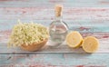 Preaparation for home made Elderberry syrup. Home made with sugar, and lemons. On the wooden background.