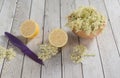 Preaparation for home made Elderberry syrup. Home made with sugar, and lemons. On the wooden background.