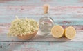 Preaparation for home made Elderberry syrup. Home made with sugar, and lemons. On the wooden background.