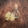 Preaparation for home made Elderberry syrup. Home made with sugar, and lemons. On the wooden background.