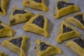 Prebaked `Haman pockets` also known as Hamantashen, an Ashkenazi Jewish triangular filled-pocket cookies, usually associated with Royalty Free Stock Photo
