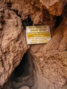 A Sign Warns Hikers of Dangers along Trail to the Base of Mooney Falls Royalty Free Stock Photo