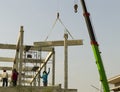 precast concrete beam instralled at construction site by mobile crane