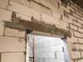 Precast concrete lintels are installed on wall openings such as doors and windows to support the bricks above. Royalty Free Stock Photo