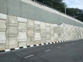 Precast concrete retaining wall panels are installed in layers as a retaining wall. Royalty Free Stock Photo