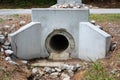 Precast formed concrete headwall for drainage pipe under a street, rainwater runoff culvert