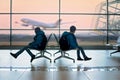 Prechool children with backpacks, at the airport, going on holiday, happy