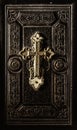 Precious antique Bible cover with golden cross