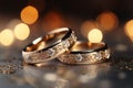 Precious bands Silver and gold wedding rings, bokeh background allure Royalty Free Stock Photo