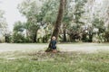 Precious Little Toddler Boy Dressed Up in the Outdoors Forest Park for Portraits in Autumn by Big Natural Tree Having Excited Fun Royalty Free Stock Photo