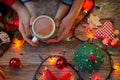 mother and child holding together a cup of hot tea in a festive Christmas dÃÆÃÂ©cor, waiting for San