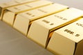 Precious shiny gold bars on light background