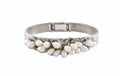 Precious silver bracelet with pearls under the lights isolated on a white background