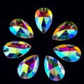Precious stones crystals in the shape a tear drop on a black acrilic background. Royalty Free Stock Photo