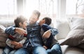 Precious time spent with precious people. two adorable little boys having fun with their father at home. Royalty Free Stock Photo