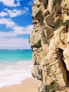 Precipitous cliff on torquoise sea in a sunny day