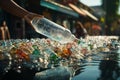 Precise angle womans hand throws plastic bottle in recycling bin, promoting recycling habits