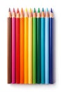 A vertical row of sharpened colored pencils in a vibrant rainbow spectrum on a white background Royalty Free Stock Photo